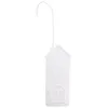 A white house-shaped radiator humidifier hangs from a hook against a white background. Voir les images du produit