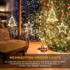 A cozy living room scene with a Christmas tree and window decorations. Produktbild-Vorschau