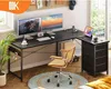 A modern L-shaped desk setup with dual monitors, a chair, and a plant. Náhled obrázku produktu