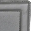 A close-up view of the corner of a gray upholstered chair. Voir les images du produit