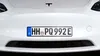 Close-up of the front of a white Tesla car, showing the license plate. Náhled obrázku produktu