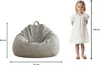 A child is shown next to a beanbag chair with dimensions indicated by measurement lines and numbers. Produktbild-Vorschau