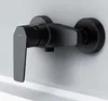 A black shower faucet mounted on a white wall above a white bathtub edge. Produktbild-Vorschau