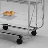 Close-up of a serving trolley with croissants on a plate. Produktbild-Vorschau
