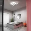 A modern bedroom with a bed, a ceiling light, and a mirror. Náhled obrázku produktu