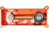 A top-down view of an orange plastic housing with brass plumbing components inside, against a white background. Produktbild-Vorschau