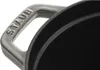 A close-up shot of a black pot handle with the brand name 'STAUB' embossed on it. Podgląd zdjęcia produktu