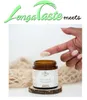 A finger is shown applying cream from a jar, with a textured fabric in the background. Produktbild-Vorschau