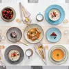 A table setting with various dishes and tableware. Náhled obrázku produktu