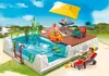 A Playmobil swimming pool set with figures enjoying the pool and sun. Voir les images du produit