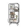 A white and black bookshelf with decorative items on display. Produktbild-Vorschau