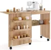 A sewing machine table with storage compartments and a sewing machine on top. Produktbild-Vorschau