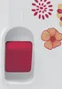 A close-up of a sewing machine with decorative floral elements. Produktbild-Vorschau