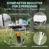 An outdoor scene with camping equipment, featuring a folding table. Produktbild-Vorschau
