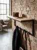 Detailaufnahme der Maserung des Akazie Massivholzes der Wandgarderobe. Die natürliche Holzstruktur und die klare Lackierung sind deutlich sichtbar._#sku_SAFWL6.354# Produktbild-Vorschau