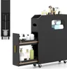 A black bathroom storage cabinet with two pull-out drawers and a top compartment, displayed against a white background. The cabinet is shown with various toiletries and makeup brushes on top and inside the drawers. Produktbild-Vorschau