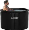 A man is sitting in a black inflatable hot tub filled with water. Produktbild-Vorschau