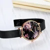 A close-up shot of a women's watch with a floral design on the dial. Náhled obrázku produktu