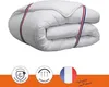 A folded white quilt with red, white, and blue stripes. Produktbild-Vorschau