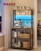 A multi-shelf kitchen rack with a coffee machine, mugs, bottles, and decorative items, illuminated by blue LED lights. Produktbild-Vorschau