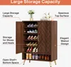 A wooden shoe cabinet with doors, filled with shoes and decorative items on top. Náhľad obrázku produktu