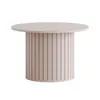 A round coffee table with a fluted base. Produktbild-Vorschau