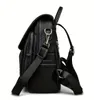 A black leather backpack shown from the side against a white background. Podgląd zdjęcia produktu