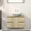 A bathroom vanity with a sink and faucet. Náhled obrázku produktu