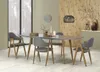 A dining room setting with a table and chairs. Podgląd zdjęcia produktu