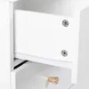 Close-up view of an open drawer in a white cabinet, showing drawer slides and screws. Náhľad obrázku produktu