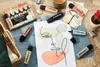 A flat lay of STABILO BOSS ORIGINAL NatureCOLORS highlighters arranged with art supplies and a small plant. Anteprima dell’immagine prodotto