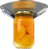 A jar of canned peaches is being held by a silver jar opener attached to a surface above. Produktbild-Vorschau