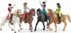 Four toy horses with riders in a line. Voir les images du produit