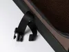 A close-up view of a black strap and buckle attached to a brown and black fabric item, likely a pet carrier or bag. Produktbild-Vorschau