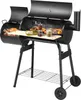 A black charcoal grill with food cooking inside, set against a white background.