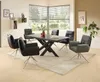 A dining room with a table and chairs set up near a window. Produktbild-Vorschau