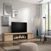 A modern living room with a TV stand featuring an electric fireplace, artwork on the wall, and a floor lamp. Produktbild-Vorschau