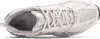 A top-down view of a white and silver New Balance sneaker. Produktbild-Vorschau