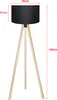 A floor lamp with a black shade and a wooden tripod base, with dimensions indicated by red lines and text. Anteprima dell’immagine prodotto