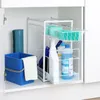A storage shelf with cleaning supplies inside a cabinet. Produktbild-Vorschau