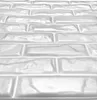 A close-up, angled view of white 3D wall panels with a brick pattern. Produktbild-Vorschau