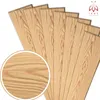 Several wooden planks are arranged in a fanned-out pattern, with a close-up inset of the wood grain. Anteprima dell’immagine prodotto