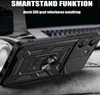 A black phone case with a ring holder is shown in a close-up shot, with a laptop and headphones blurred in the background. Produktbild-Vorschau