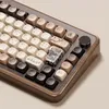 A close-up view of a mechanical keyboard with a wooden frame and various keycaps. Produktbild-Vorschau