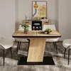 A dining table set in a dining room with a sideboard and artwork in the background. Anteprima dell’immagine prodotto