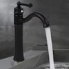 A black bathroom faucet with water running. Náhled obrázku produktu