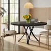 A round dining table with chairs in a dining room setting. Anteprima dell’immagine prodotto