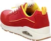 A side view of a red and yellow sneaker. Produktbild-Vorschau