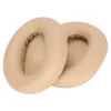 Two beige ear pads for headphones are shown on a white background. Podgląd zdjęcia produktu