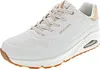 A white Skechers Uno sneaker with tan accents and a gum sole, shown from a side angle against a white background. Náhled obrázku produktu